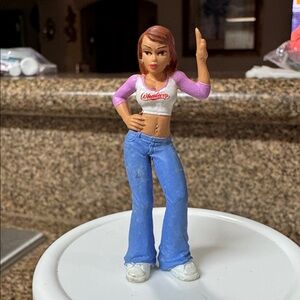 The figurine is "Big Booty Nancy" from the Lil' Locsters Series 3